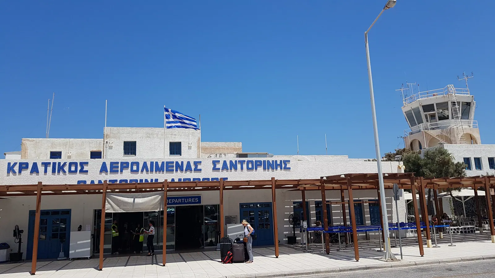 The terminal building of Santorini Airport, where drivers wait at the arrivals exit