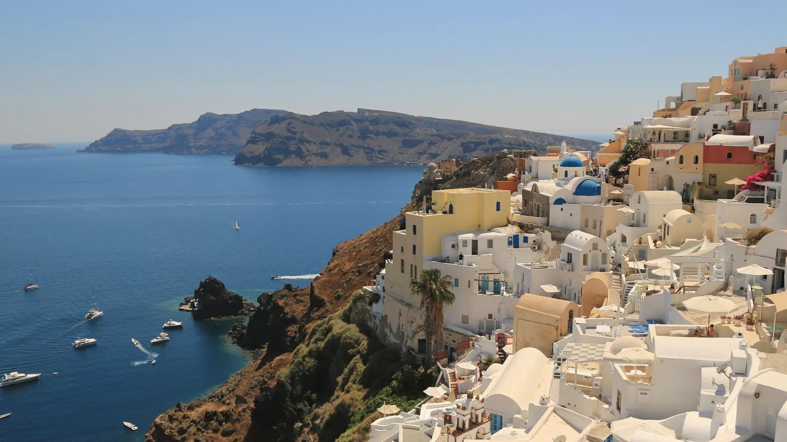 Fira on the cliff edge with the old port and the caldera below