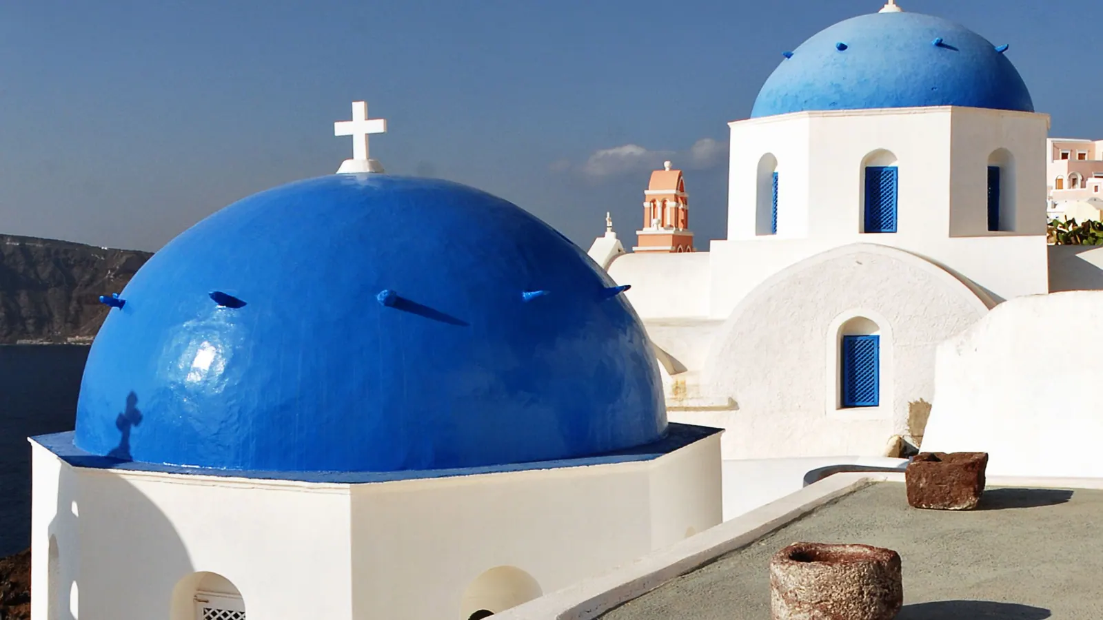 The blue domes of a church in Firostefani above the caldera