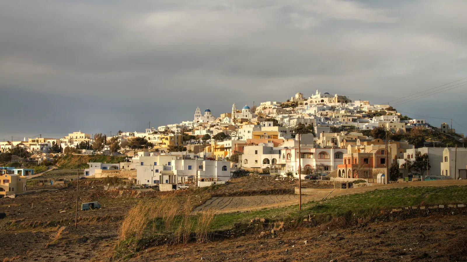 Pyrgos village on its hill in the afternoon light