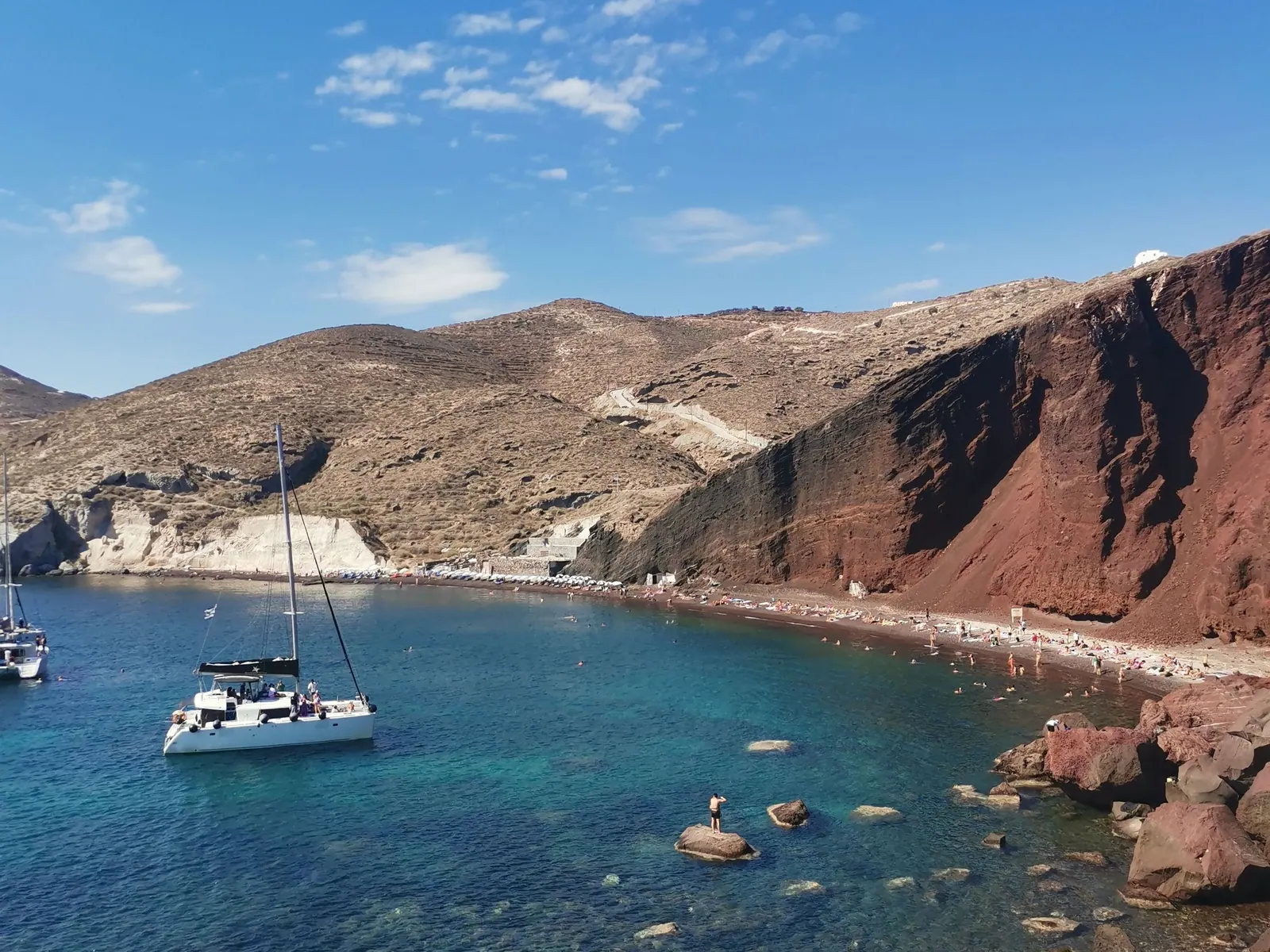 Red Beach at Akrotiri with boats in the cove