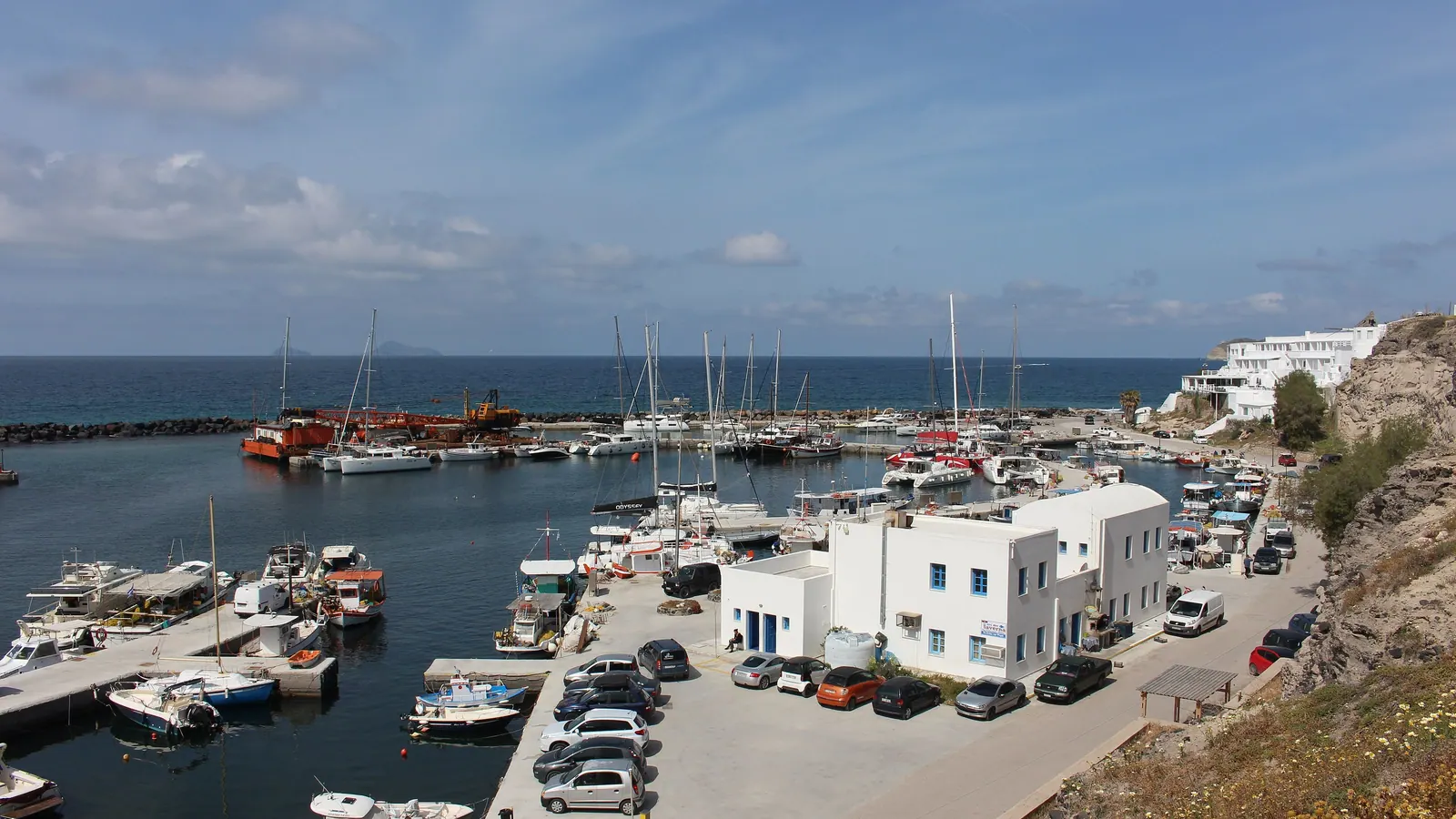 Vlychada marina with boats moored along the quay